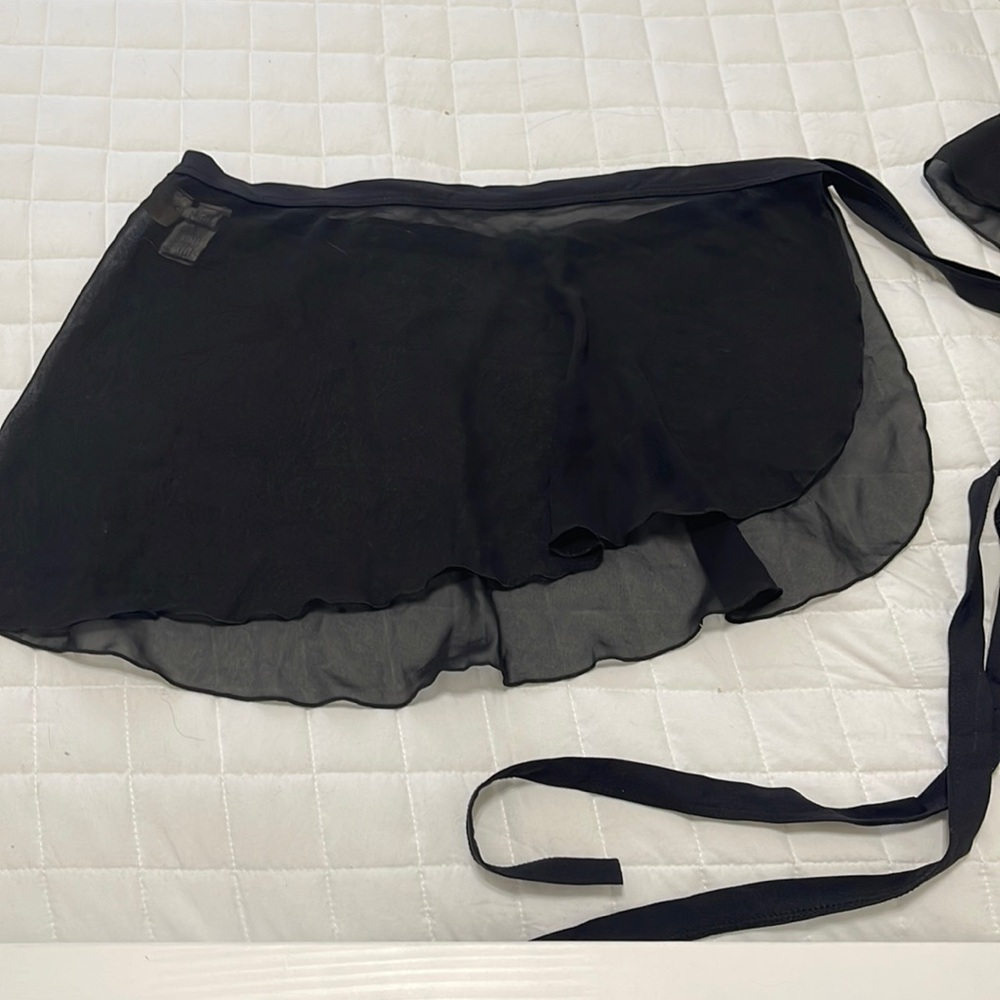 Capezio black sheer wrap around style ballet skirt. M/L